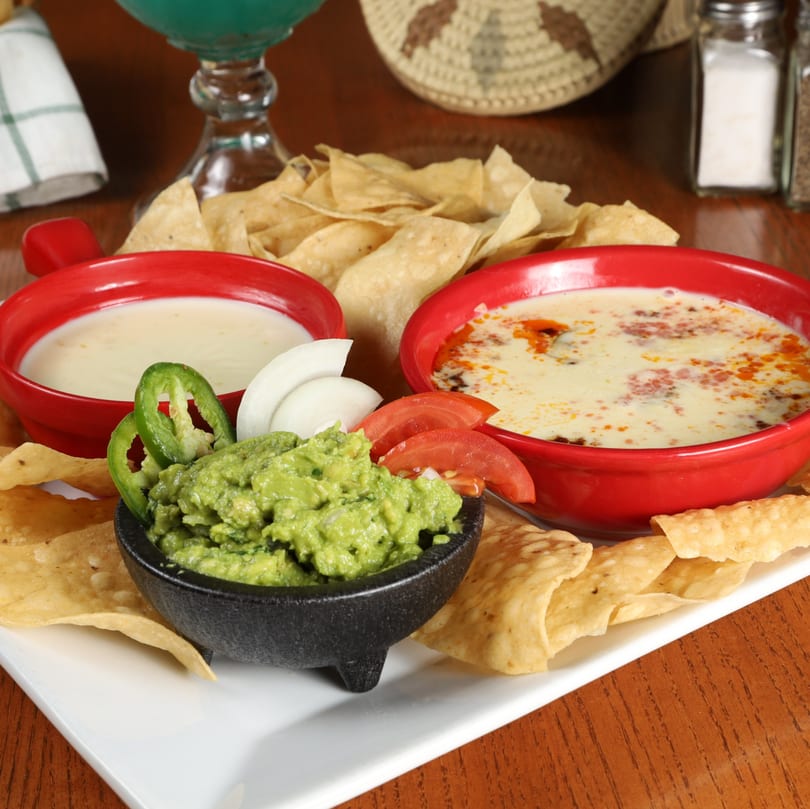 Agavero's Mexican Bar and Grill's queso, queso fundido, and guacamole with tortilla chips.